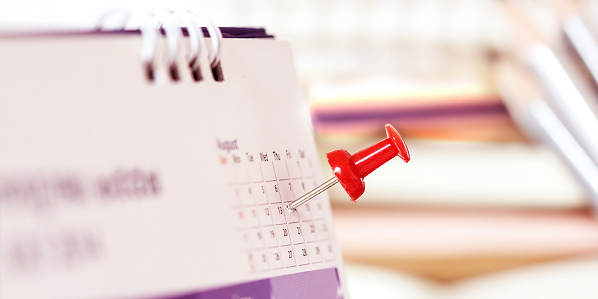 A calendar with a red thumbtack on a certain date as a reminder that you only have 14 days to make your initial disclosures according to Rule 26(f)