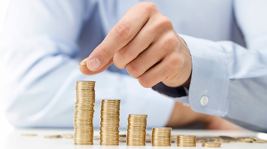 Man piling coins calculating the ROI of Ediscovery Software