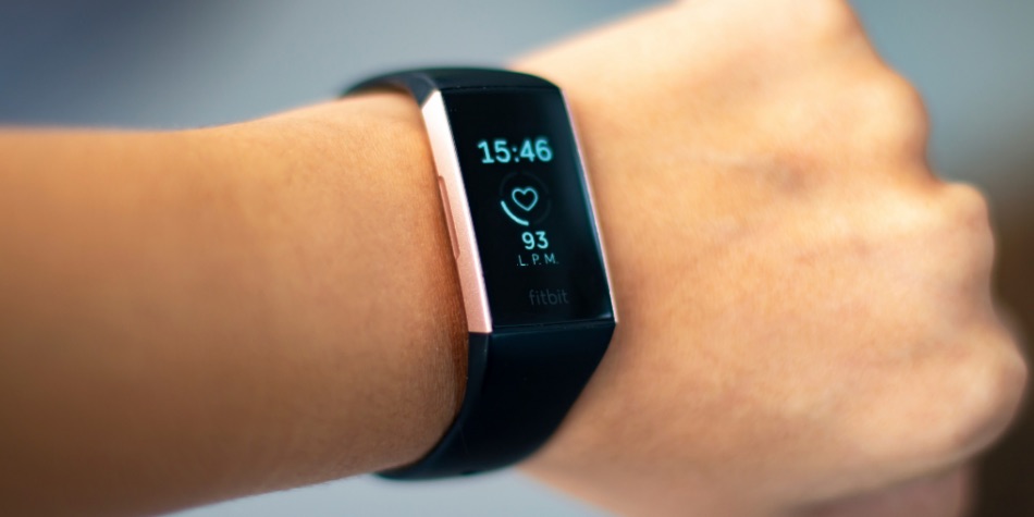 Person's arm with a Fitbit device