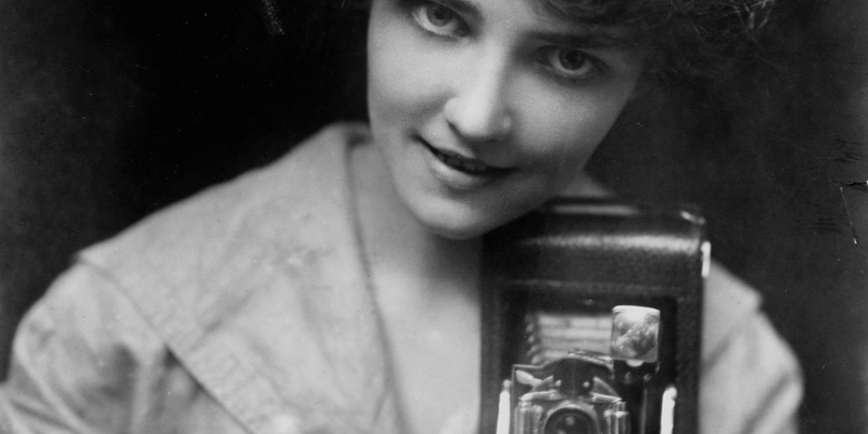 Retro image of woman with a camera